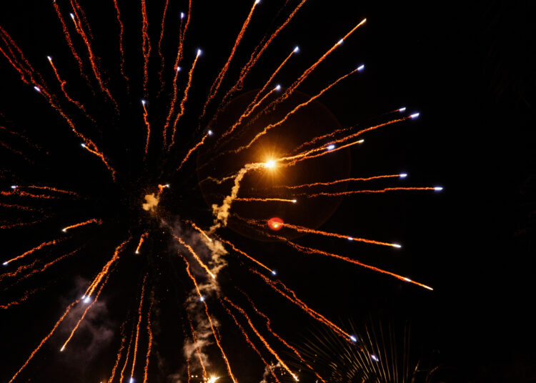 Fireworks fly like arrows in night sky